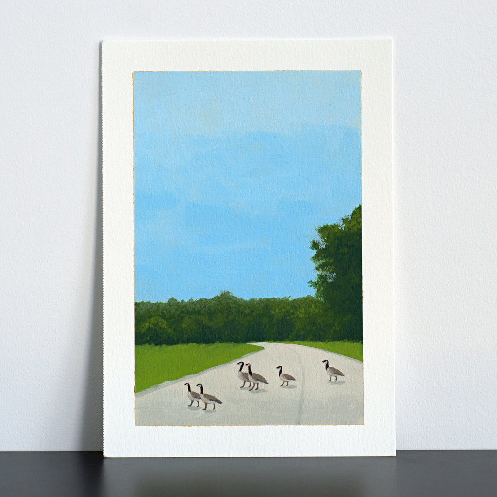 Artwork of geese crossing a road with a blue sky and green trees in the background.