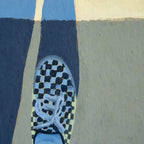 Close-up of a shoe with a checkered pattern on a multicolored background